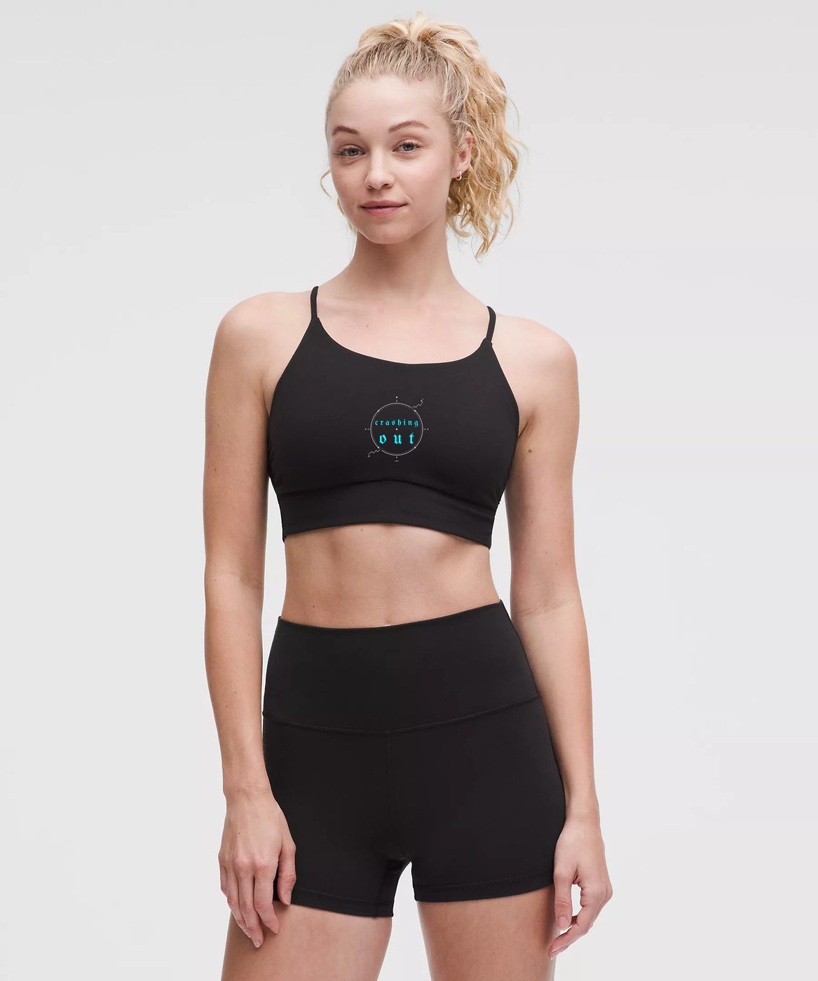Crashing Out — Black strappy cami with blue crashing out compass emblem