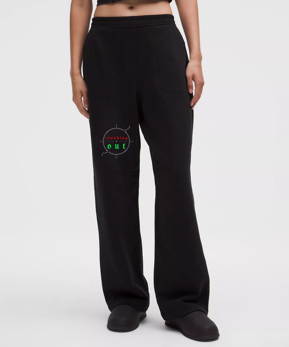 Crashing Out — Black wide-leg sweatpants with red and green crashing out emblem